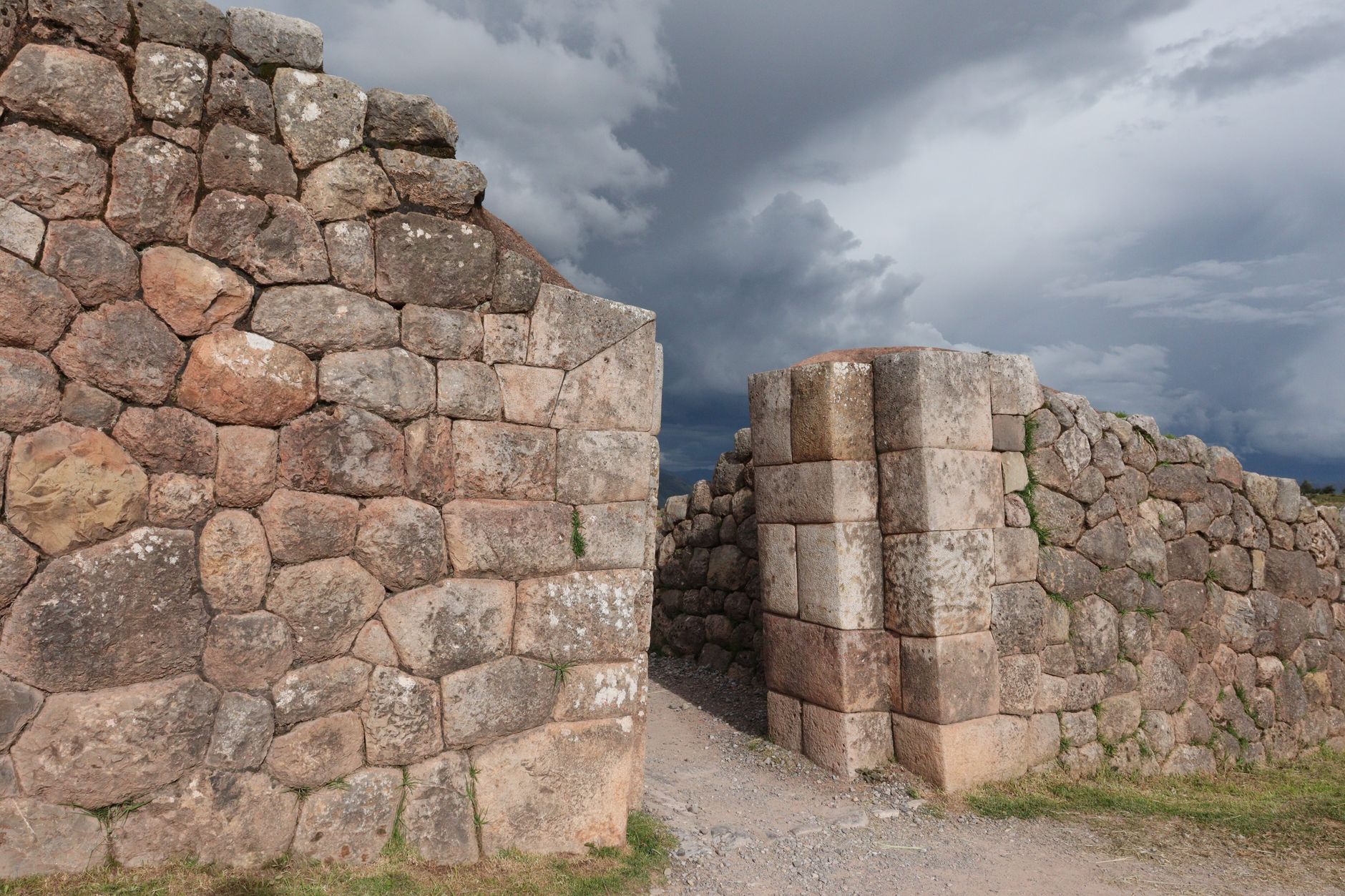 Close-up of Hadrian's Wall stone weathering showing lichen, black crust and frost damage on Roman dolerite blocks