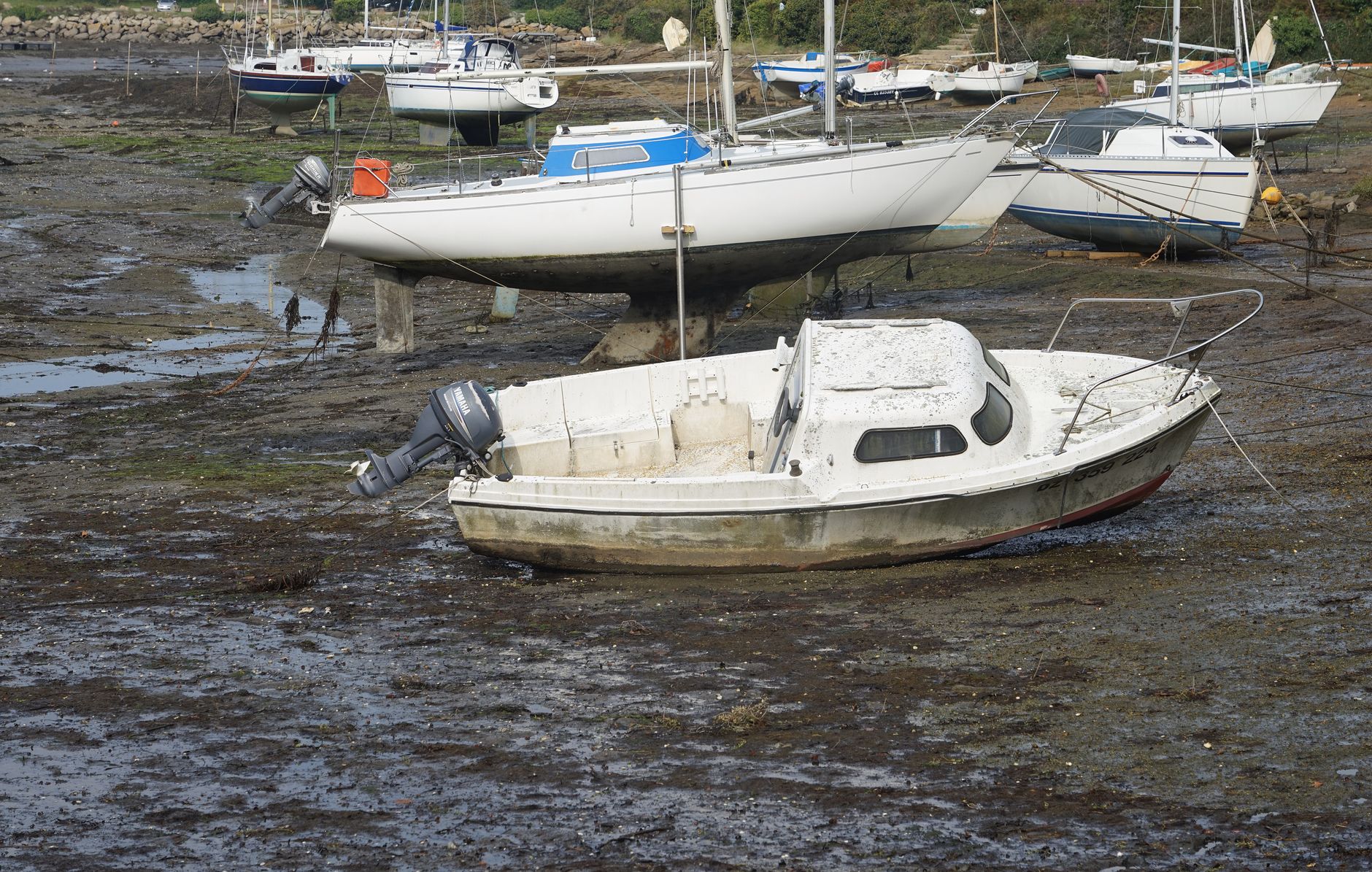 Close-up of layered tar and pitch Humber barge anti-fouling coatings on a weathered wooden hull